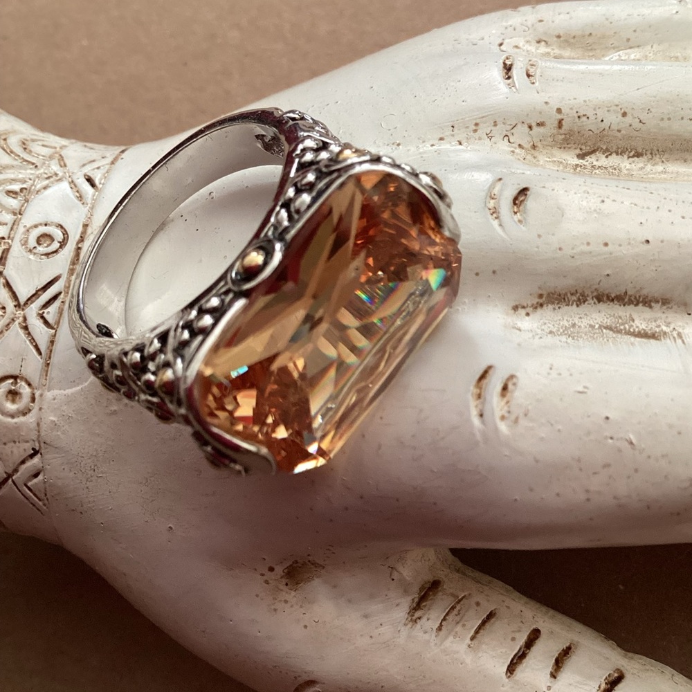 Light topaz, champagne colored sparkly stone in silver and hints of gold setting